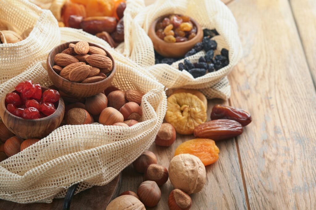 Tu Bishvat celebration concept. Mix of dry fruits and nuts almonds, hazelnuts, walnuts, apricots, pr